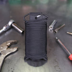 Ready Rope™ loaded with Black Paracord 550 100ft Standing up on workbench